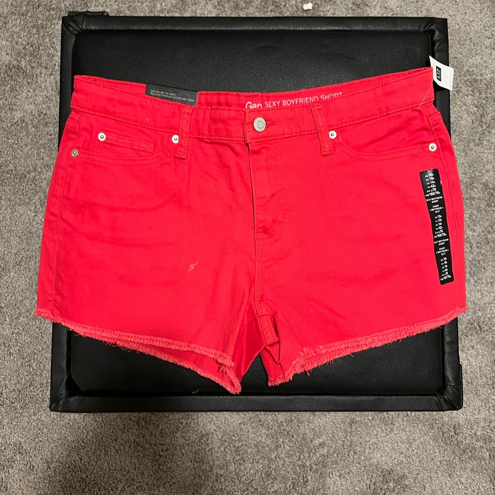 Red lightly fraid cut off shorts